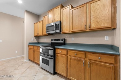 This spacious 2,013 sf home has 3 BR, 2 BA, kitchen, living rm on Estrella Mountain Ranch Golf Course in Arizona - for sale on GolfHomes.com, golf home, golf lot