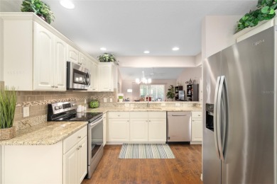 Welcome to this beautifully enhanced Wisteria model, where on Glenview Championship Golf and Country Club in Florida - for sale on GolfHomes.com, golf home, golf lot
