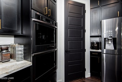 Presenting 6393 S Via De Oro, Fort Mohave, Arizona, a custom on Los Lagos Golf Club in Arizona - for sale on GolfHomes.com, golf home, golf lot