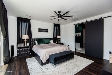 Presenting 6393 S Via De Oro, Fort Mohave, Arizona, a custom on Los Lagos Golf Club in Arizona - for sale on GolfHomes.com, golf home, golf lot