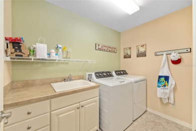 Welcome to this beautifully enhanced Wisteria model, where on Glenview Championship Golf and Country Club in Florida - for sale on GolfHomes.com, golf home, golf lot