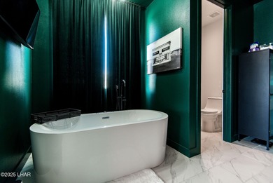 Presenting 6393 S Via De Oro, Fort Mohave, Arizona, a custom on Los Lagos Golf Club in Arizona - for sale on GolfHomes.com, golf home, golf lot