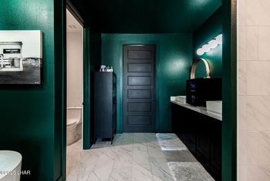 Presenting 6393 S Via De Oro, Fort Mohave, Arizona, a custom on Los Lagos Golf Club in Arizona - for sale on GolfHomes.com, golf home, golf lot