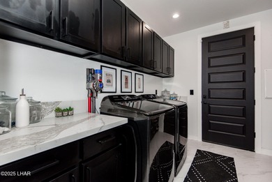 Presenting 6393 S Via De Oro, Fort Mohave, Arizona, a custom on Los Lagos Golf Club in Arizona - for sale on GolfHomes.com, golf home, golf lot