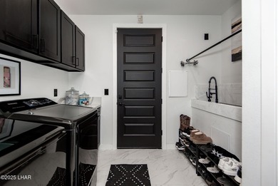 Presenting 6393 S Via De Oro, Fort Mohave, Arizona, a custom on Los Lagos Golf Club in Arizona - for sale on GolfHomes.com, golf home, golf lot