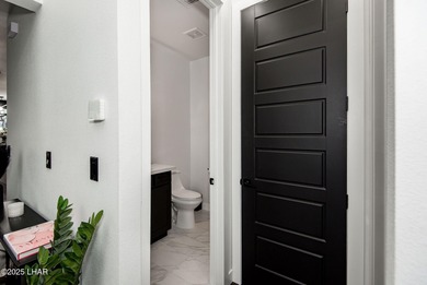 Presenting 6393 S Via De Oro, Fort Mohave, Arizona, a custom on Los Lagos Golf Club in Arizona - for sale on GolfHomes.com, golf home, golf lot