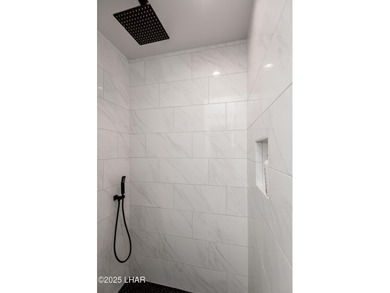 Presenting 6393 S Via De Oro, Fort Mohave, Arizona, a custom on Los Lagos Golf Club in Arizona - for sale on GolfHomes.com, golf home, golf lot