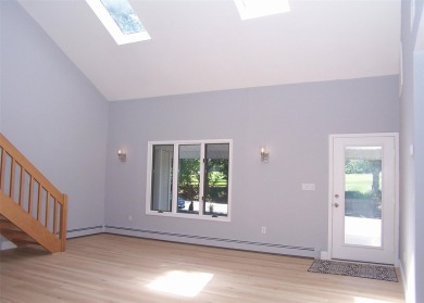 This beautiful 3 bedroom home sits right across from a scenic on St Georges Golf and Country Club in New York - for sale on GolfHomes.com, golf home, golf lot