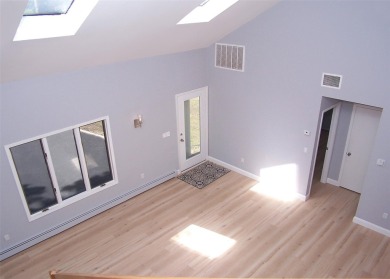 This beautiful 3 bedroom home sits right across from a scenic on St Georges Golf and Country Club in New York - for sale on GolfHomes.com, golf home, golf lot