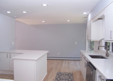 This beautiful 3 bedroom home sits right across from a scenic on St Georges Golf and Country Club in New York - for sale on GolfHomes.com, golf home, golf lot