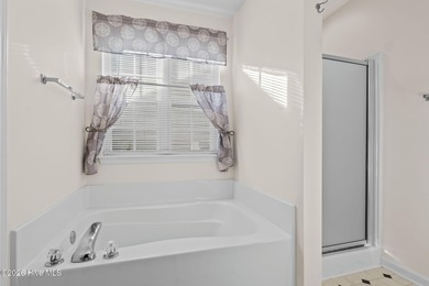 A 3 Bedroom 2 Bathroom Rancher with a 2-car Garage minutes from on Sandpiper Bay Golf and Country Club in North Carolina - for sale on GolfHomes.com, golf home, golf lot