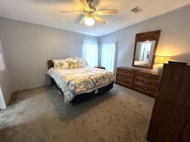 This clean and cozy 2-bedroom, 2-bathroom home offers a on Crystal Lake Club in Florida - for sale on GolfHomes.com, golf home, golf lot