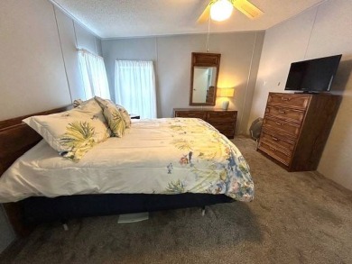 This clean and cozy 2-bedroom, 2-bathroom home offers a on Crystal Lake Club in Florida - for sale on GolfHomes.com, golf home, golf lot