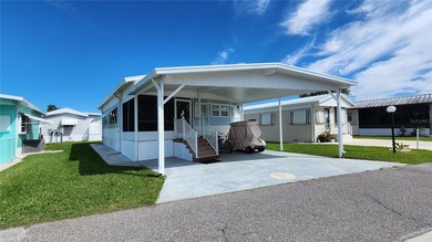 SO MUCH TO OFFER IN THIS ONE BEDROOM, 1 1/2 BATH MOBILE HOME IN on River Run Golf Links in Florida - for sale on GolfHomes.com, golf home, golf lot
