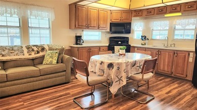 SO MUCH TO OFFER IN THIS ONE BEDROOM, 1 1/2 BATH MOBILE HOME IN on River Run Golf Links in Florida - for sale on GolfHomes.com, golf home, golf lot