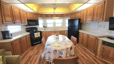 SO MUCH TO OFFER IN THIS ONE BEDROOM, 1 1/2 BATH MOBILE HOME IN on River Run Golf Links in Florida - for sale on GolfHomes.com, golf home, golf lot