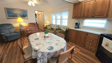 SO MUCH TO OFFER IN THIS ONE BEDROOM, 1 1/2 BATH MOBILE HOME IN on River Run Golf Links in Florida - for sale on GolfHomes.com, golf home, golf lot