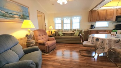 SO MUCH TO OFFER IN THIS ONE BEDROOM, 1 1/2 BATH MOBILE HOME IN on River Run Golf Links in Florida - for sale on GolfHomes.com, golf home, golf lot