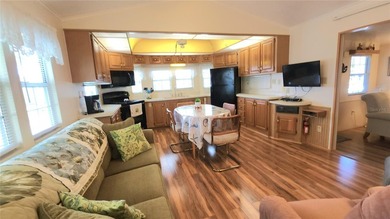 SO MUCH TO OFFER IN THIS ONE BEDROOM, 1 1/2 BATH MOBILE HOME IN on River Run Golf Links in Florida - for sale on GolfHomes.com, golf home, golf lot