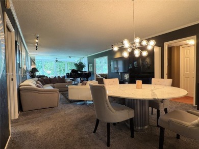 BEAUTIFUL GOLF COURSE VIEWS provide a serene environment for on Palm-Aire Country Club and Resort - Palms in Florida - for sale on GolfHomes.com, golf home, golf lot
