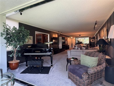 BEAUTIFUL GOLF COURSE VIEWS provide a serene environment for on Palm-Aire Country Club and Resort - Palms in Florida - for sale on GolfHomes.com, golf home, golf lot