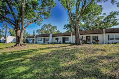 Lovely Highland Lakes villa located in Mission Grove. This villa on Highland Lakes Executive Golf Course in Florida - for sale on GolfHomes.com, golf home, golf lot
