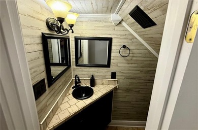 Welcome to an exceptional family retreat where luxury, lifestyle on Cypress Country Club and Golf Club  in AL - for sale on GolfHomes.com, golf home, golf lot