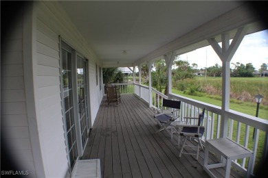 14112 CLUBHOUSE DR BOKEELIA FL 33922 IS A 2 LARGE BEDROOM 2 BATH on Alden Pines Golf Club in Florida - for sale on GolfHomes.com, golf home, golf lot