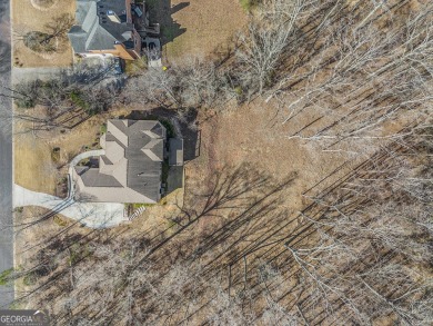 STUNNING 4-sided brick, Smart Home in the highly sought-after on Wendell Coffee Golf Center in Georgia - for sale on GolfHomes.com, golf home, golf lot