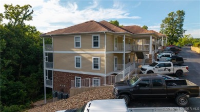 These condos are hard to come by at The Pines at Osage National on Osage National Golf Club in Missouri - for sale on GolfHomes.com, golf home, golf lot