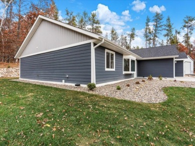 This modern, low-maintenance retreat is perfect for those who on Breezy Point Golf Course Resort in Minnesota - for sale on GolfHomes.com, golf home, golf lot