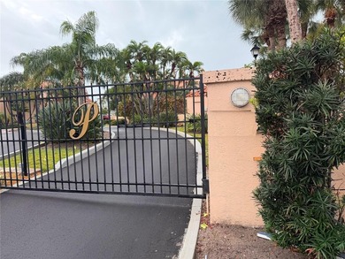 Nestled in the calm, serene, private gated-community of Royal on Pasadena Yacht and Country Club in Florida - for sale on GolfHomes.com, golf home, golf lot