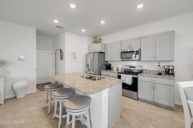 You'll love coming home to this stunning 2023-built waterfront on Venetian Bay Golf Course in Florida - for sale on GolfHomes.com, golf home, golf lot