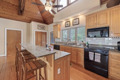 Experience breathtaking lake views from this charming 3-bedroom on The Golf Club at Cuscowilla in Georgia - for sale on GolfHomes.com, golf home, golf lot