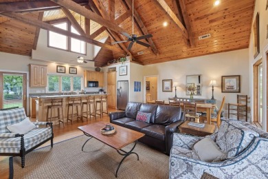 Experience breathtaking lake views from this charming 3-bedroom on The Golf Club at Cuscowilla in Georgia - for sale on GolfHomes.com, golf home, golf lot