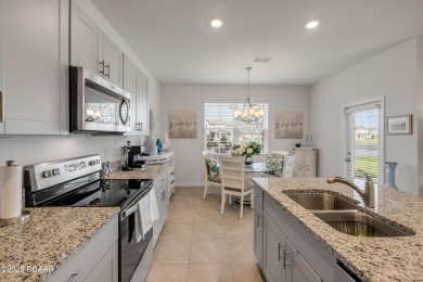 You'll love coming home to this stunning 2023-built waterfront on Venetian Bay Golf Course in Florida - for sale on GolfHomes.com, golf home, golf lot