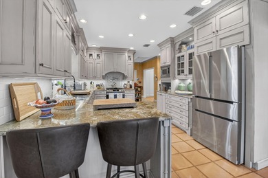 Pristine, traditional home offering 3 bedrooms/den with over on Delray Dunes Golf and Country Club in Florida - for sale on GolfHomes.com, golf home, golf lot