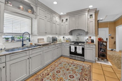 Pristine, traditional home offering 3 bedrooms/den with over on Delray Dunes Golf and Country Club in Florida - for sale on GolfHomes.com, golf home, golf lot