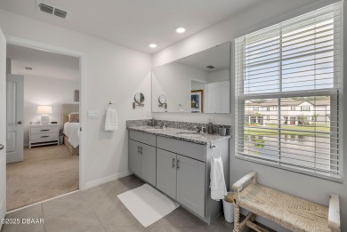 You'll love coming home to this stunning 2023-built waterfront on Venetian Bay Golf Course in Florida - for sale on GolfHomes.com, golf home, golf lot