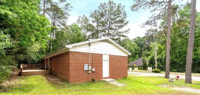 This remodeled 3-bedroom, 2-bath brick home is centrally located on Lake Forest Yacht and Country Club in Alabama - for sale on GolfHomes.com, golf home, golf lot