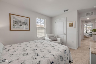 You'll love coming home to this stunning 2023-built waterfront on Venetian Bay Golf Course in Florida - for sale on GolfHomes.com, golf home, golf lot