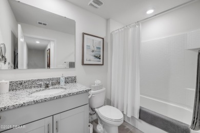 You'll love coming home to this stunning 2023-built waterfront on Venetian Bay Golf Course in Florida - for sale on GolfHomes.com, golf home, golf lot