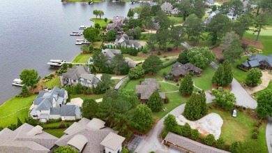 Experience breathtaking lake views from this charming 3-bedroom on The Golf Club at Cuscowilla in Georgia - for sale on GolfHomes.com, golf home, golf lot