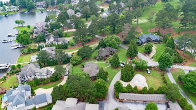 Experience breathtaking lake views from this charming 3-bedroom on The Golf Club at Cuscowilla in Georgia - for sale on GolfHomes.com, golf home, golf lot
