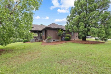Experience breathtaking lake views from this charming 3-bedroom on The Golf Club at Cuscowilla in Georgia - for sale on GolfHomes.com, golf home, golf lot