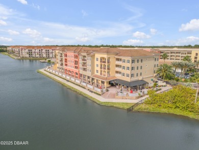 You'll love coming home to this stunning 2023-built waterfront on Venetian Bay Golf Course in Florida - for sale on GolfHomes.com, golf home, golf lot