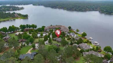 Experience breathtaking lake views from this charming 3-bedroom on The Golf Club at Cuscowilla in Georgia - for sale on GolfHomes.com, golf home, golf lot