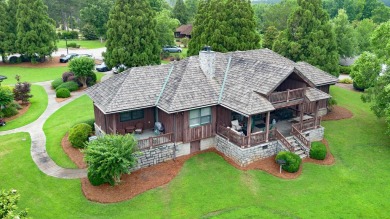 Experience breathtaking lake views from this charming 3-bedroom on The Golf Club at Cuscowilla in Georgia - for sale on GolfHomes.com, golf home, golf lot