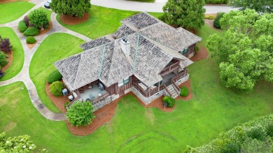 Experience breathtaking lake views from this charming 3-bedroom on The Golf Club at Cuscowilla in Georgia - for sale on GolfHomes.com, golf home, golf lot