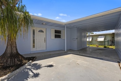 Beautifully renovated 4 bedroom single family home just minutes on Club Med Sandpiper in Florida - for sale on GolfHomes.com, golf home, golf lot
